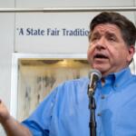 Gov. JB Pritzker takes questions at the Illinois State Fairgrounds in Springfield on Aug. 12, 2026. (Capitol News Illinois photo by Jerry Nowicki)