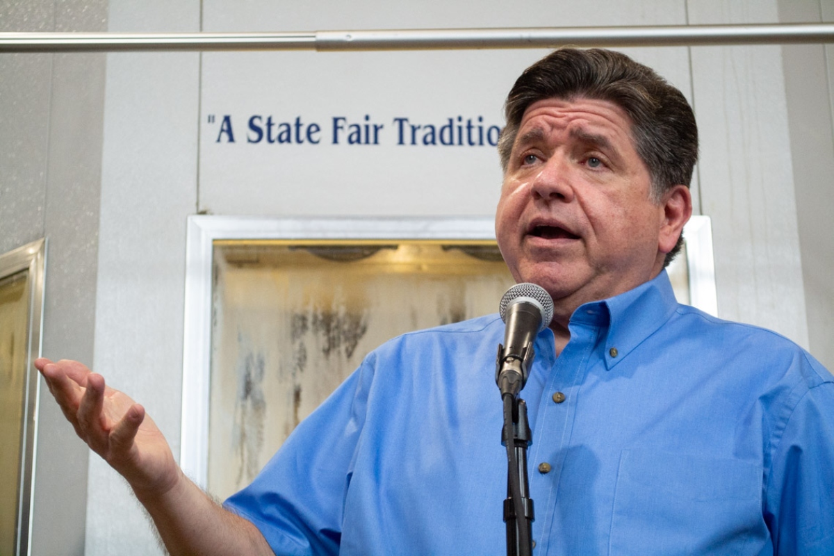 Gov. JB Pritzker takes questions at the Illinois State Fairgrounds in Springfield on Aug. 12, 2026. (Capitol News Illinois photo by Jerry Nowicki)