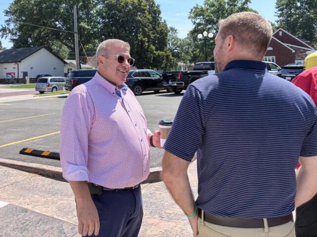 Republican Darren Bailey speaks to a supporter at an event in Nokomis on Monday, Aug. 24, 2026. (Capitol News Illinois photo by Ben Szalinski)