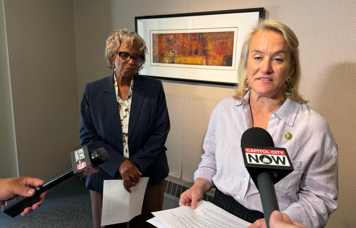 State Sen. Doris Turner (D-Springfield, left) and U.S. Rep. Nikki Budzinski, speak to reporters Thursday, Aug. 20, in downtown Springfield.