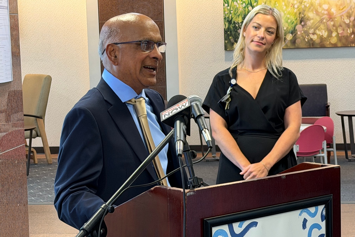 Dr. Babu Prasad, retired, talks about a $1 million donation made to HSHS St. John's Children's Hospital through its foundation, as foundation Director Ali Farmer looks on, Tuesday, August 11.