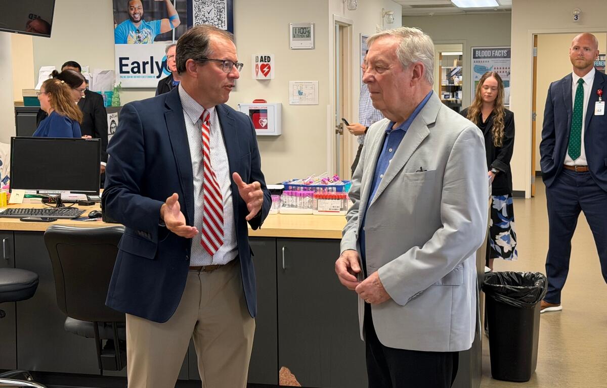 Sen. Dick Durbin (D-IL), right, speaks with Kirby Winn, spokesperson for ImpactLife blood centers.
