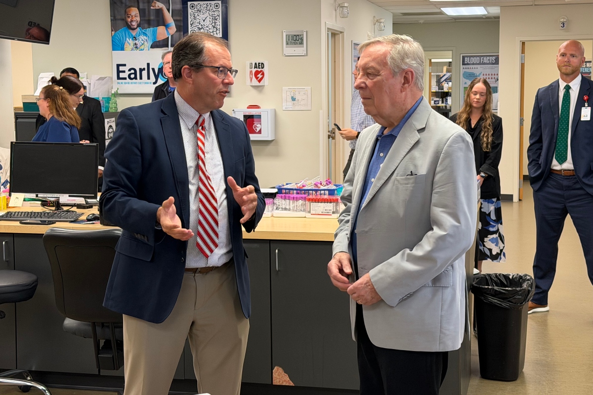 Sen. Dick Durbin (D-IL), right, speaks with Kirby Winn, spokesperson for ImpactLife blood centers.