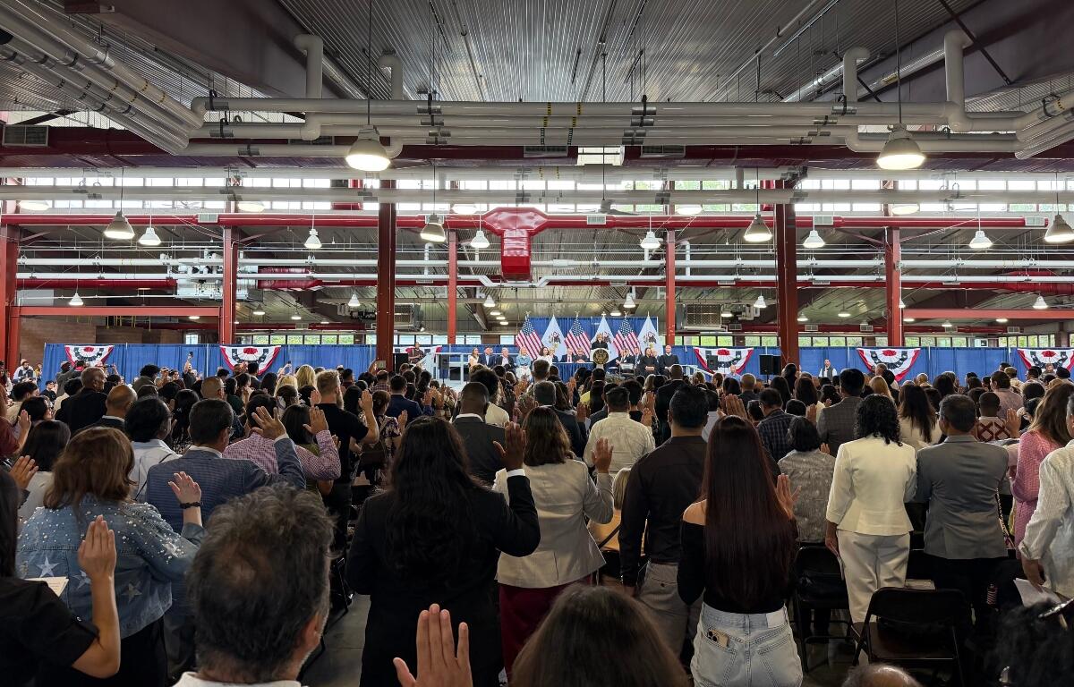 300 people, and their families, take part in a naturalization ceremony Wednesday, August 19, at the Illinois State Fairgrounds.