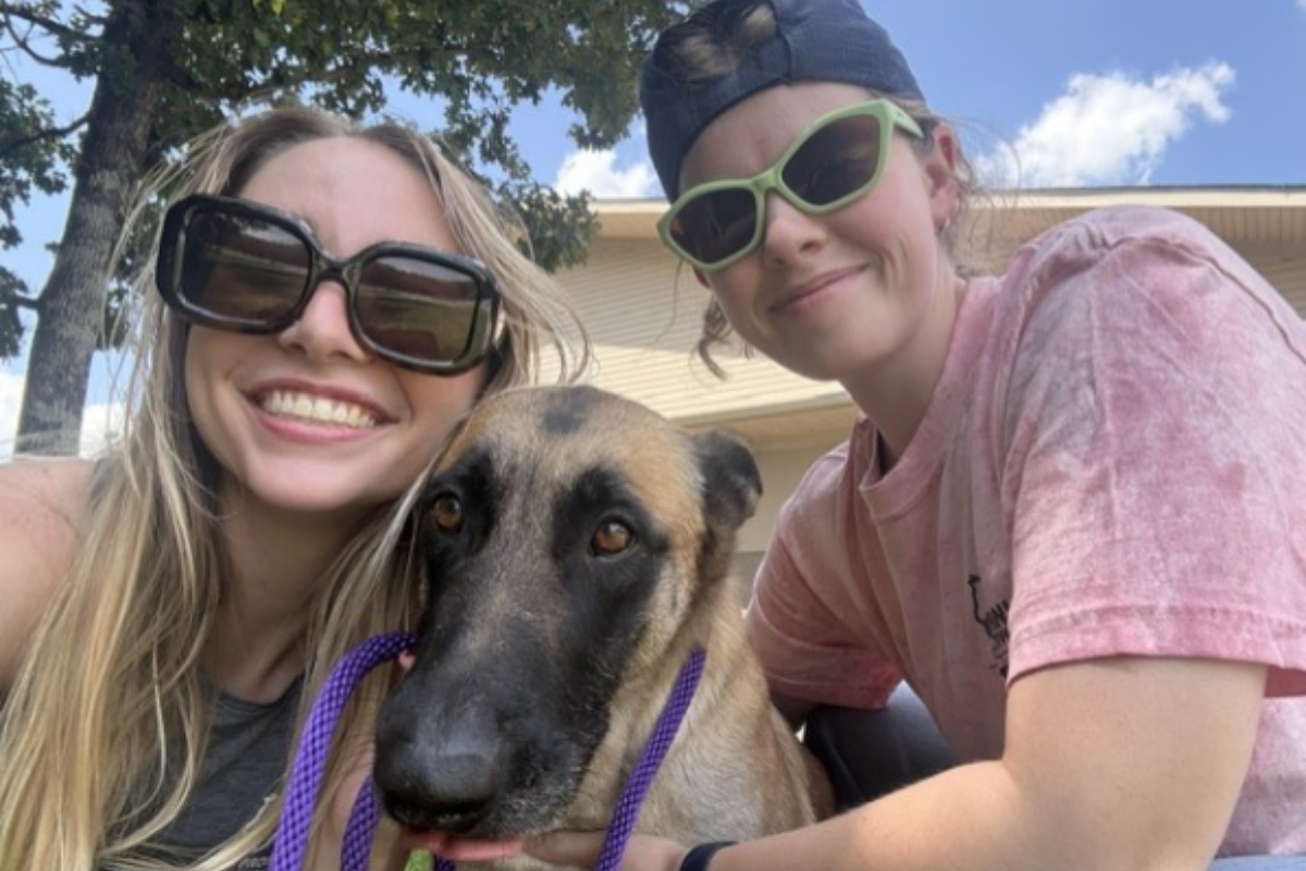 Animal Protective League staff members Amelia Bluhm and Jenna Holmes help care for a dog at Barrow County Animal Services in Georgia.