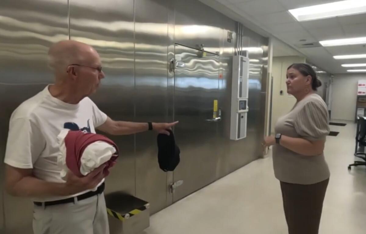 David Butt talks to an employee of ImpactLife in Springfield.