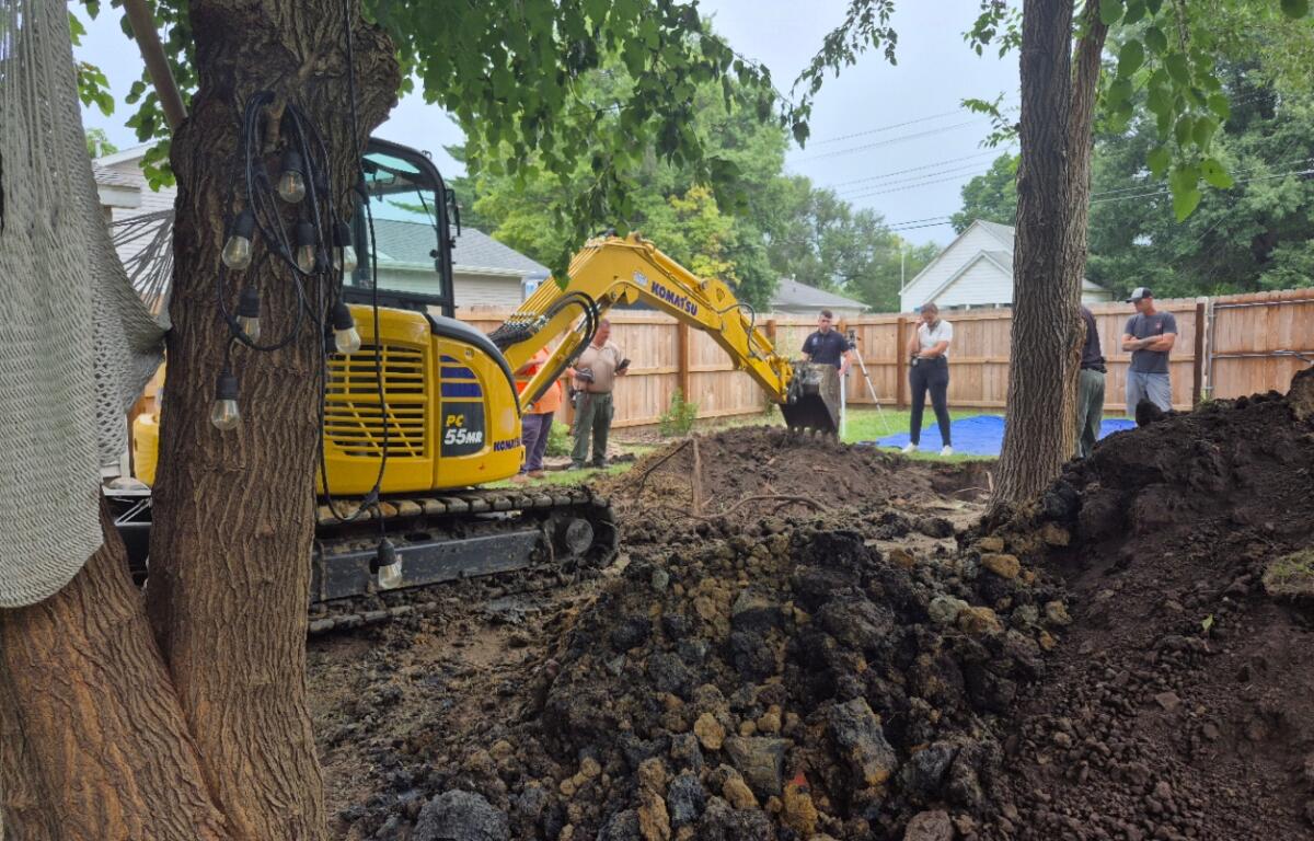 Crews dig up the back yard of an undisclosed home in Auburn in the investigation of Brenda Bottoms, reported missing in 1987.