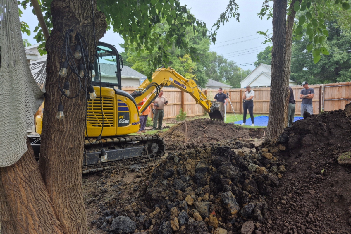 Crews dig up the back yard of an undisclosed home in Auburn in the investigation of Brenda Bottoms, reported missing in 1987.