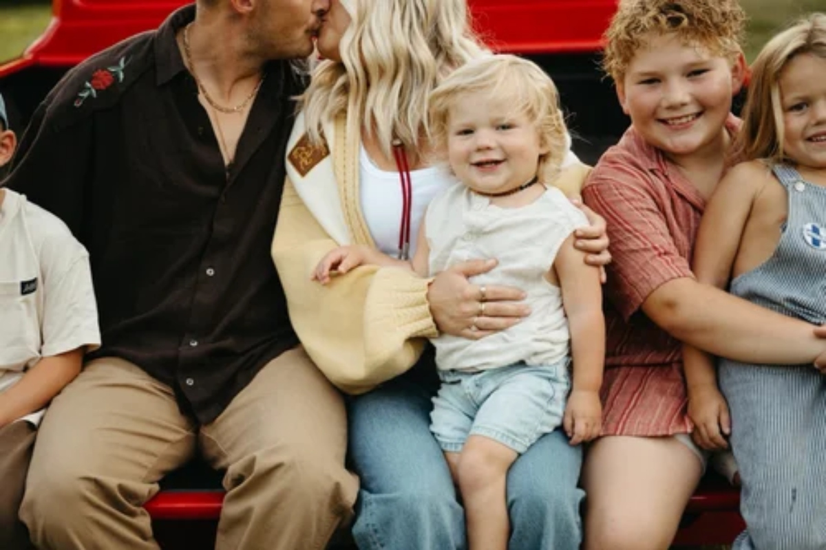 Hayes Johnson sits on his mother's lap in this photo.