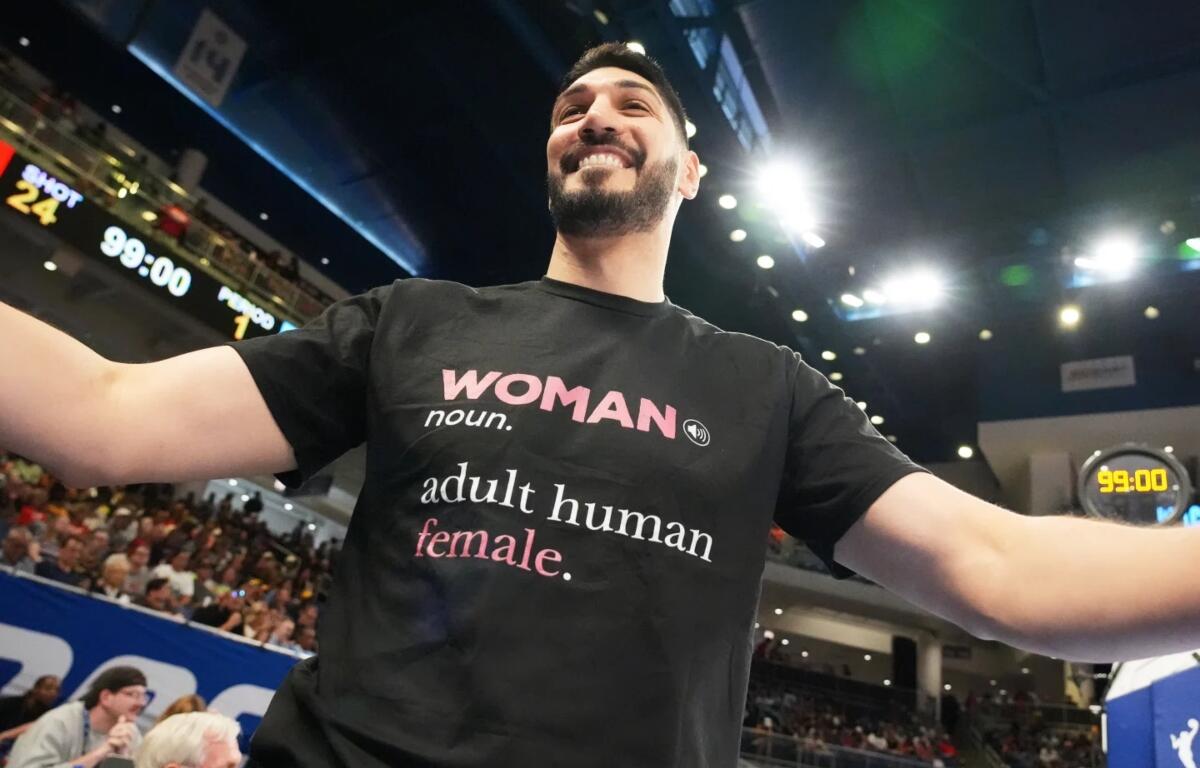 Former NBA center Enes Kanter Freedom greets a friend before a WNBA basketball game between the Indiana Fever and the Chicago Sky, Sunday, Aug. 23, 2026, in Chicago. (AP Photo/Nam Y. Huh)