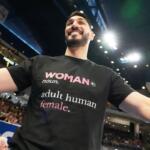 Former NBA center Enes Kanter Freedom greets a friend before a WNBA basketball game between the Indiana Fever and the Chicago Sky, Sunday, Aug. 23, 2026, in Chicago. (AP Photo/Nam Y. Huh)