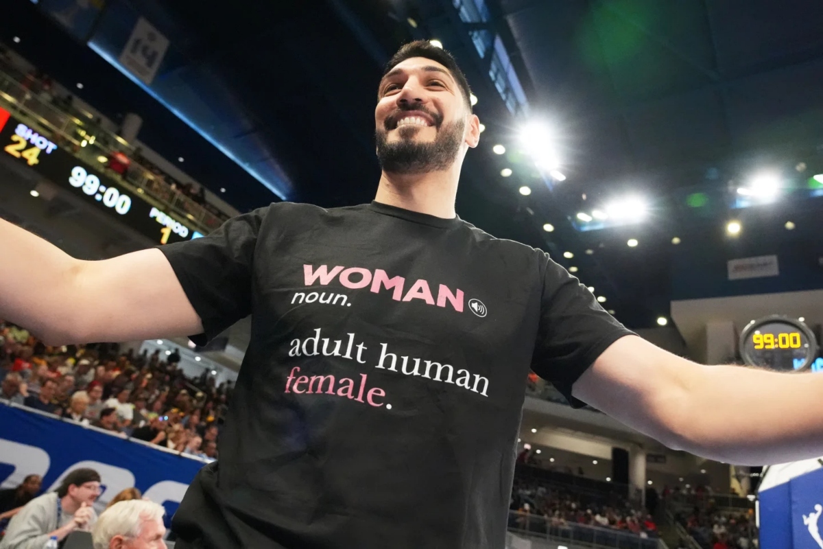Former NBA center Enes Kanter Freedom greets a friend before a WNBA basketball game between the Indiana Fever and the Chicago Sky, Sunday, Aug. 23, 2026, in Chicago. (AP Photo/Nam Y. Huh)
