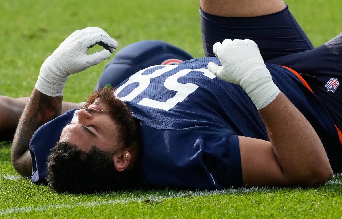 Chicago Bears offensive line Darnell Wright warms up during practice at the team's NFL football training camp, Friday, July 31, 2026, in Lake Forest, Ill. (AP Photo/Nam Y. Huh)