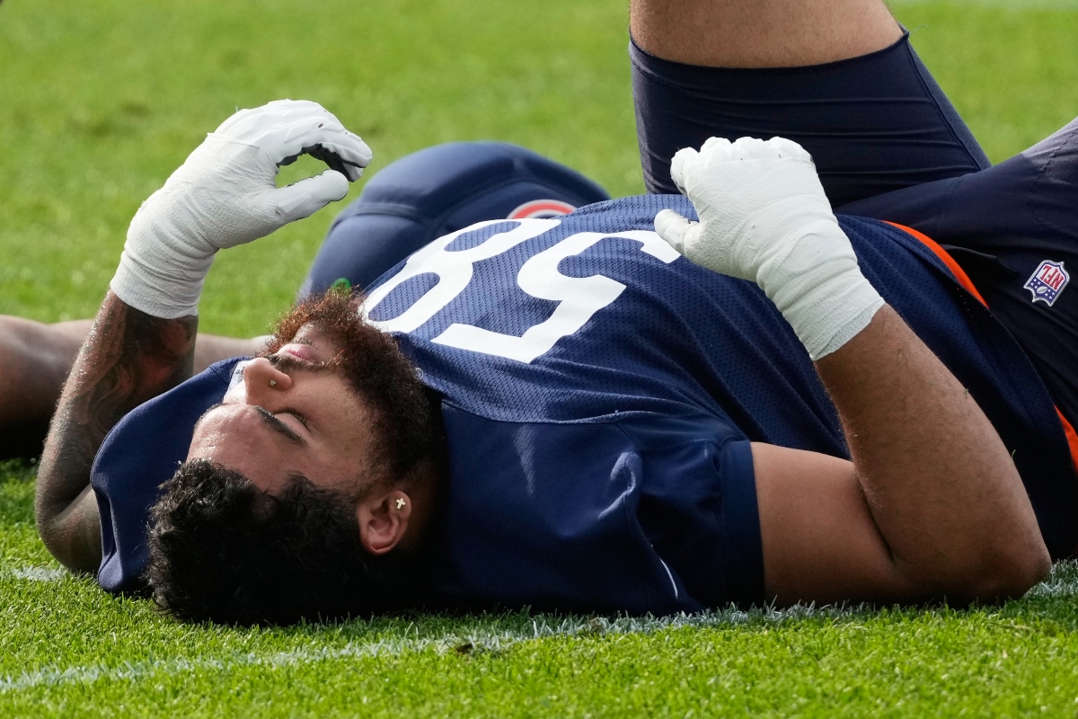Chicago Bears offensive line Darnell Wright warms up during practice at the team's NFL football training camp, Friday, July 31, 2026, in Lake Forest, Ill. (AP Photo/Nam Y. Huh)