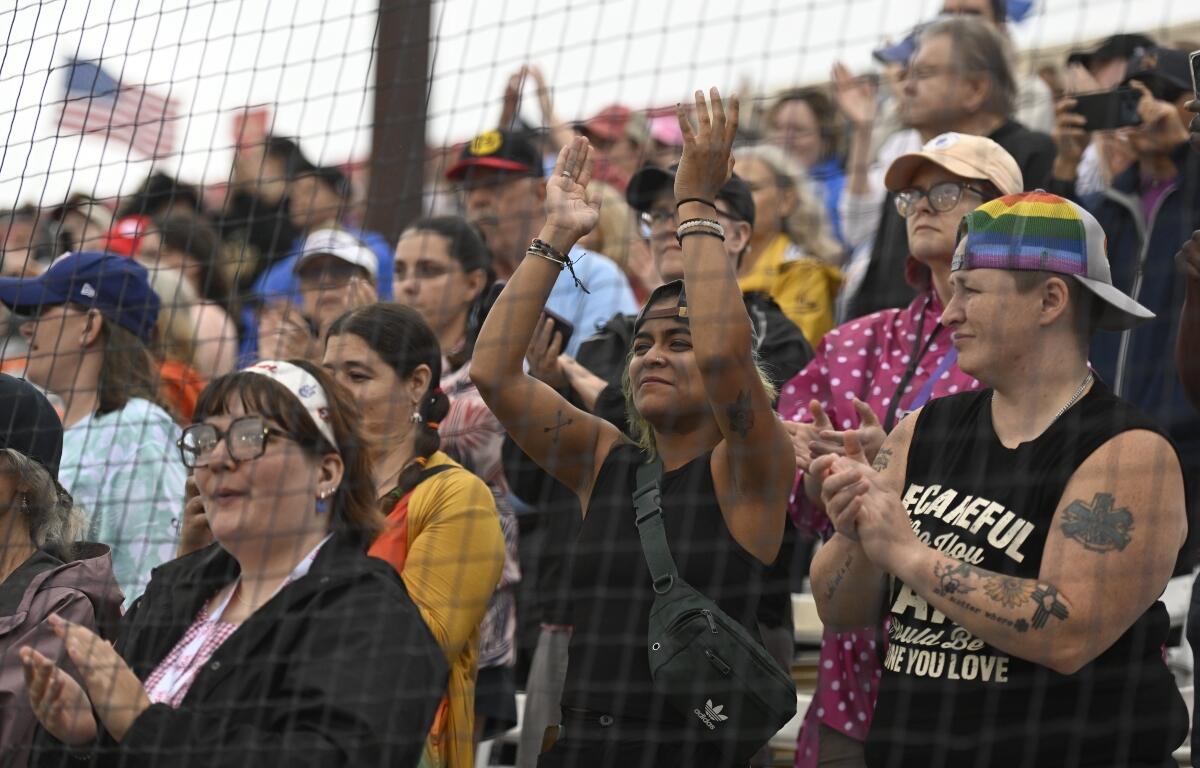 Fans cheer before the inaugural Women's Professional Baseball League game between the Los Angeles Queens and the New York Heights, Saturday, Aug. 1, 2026, in Springfield, Ill. (AP Photo/Lexie Knight)