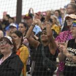 Fans cheer before the inaugural Women's Professional Baseball League game between the Los Angeles Queens and the New York Heights, Saturday, Aug. 1, 2026, in Springfield, Ill. (AP Photo/Lexie Knight)