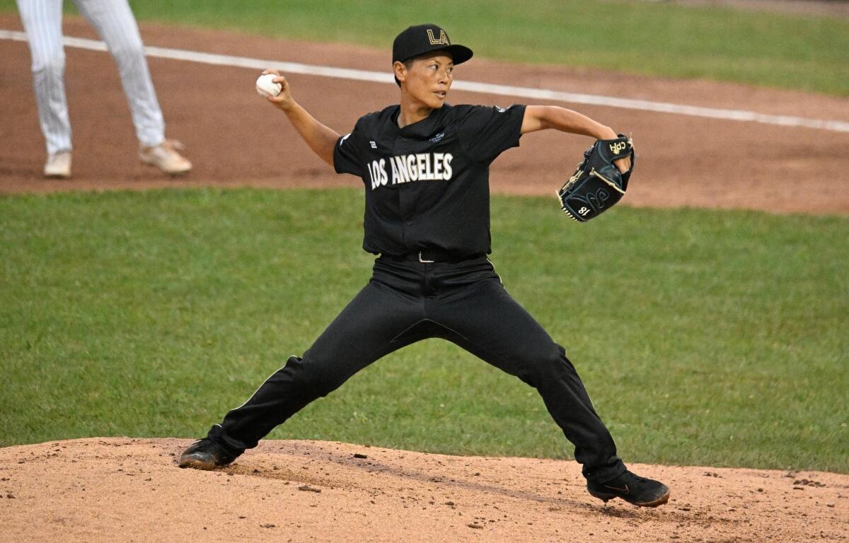 Los Angeles Queens' Ayami Sato pitches during the fourth inning of the inaugural Women's Professional Baseball League game against the New York Heights, Saturday, Aug. 1, 2026, in Springfield, Ill. (AP Photo/Lexie Knight)