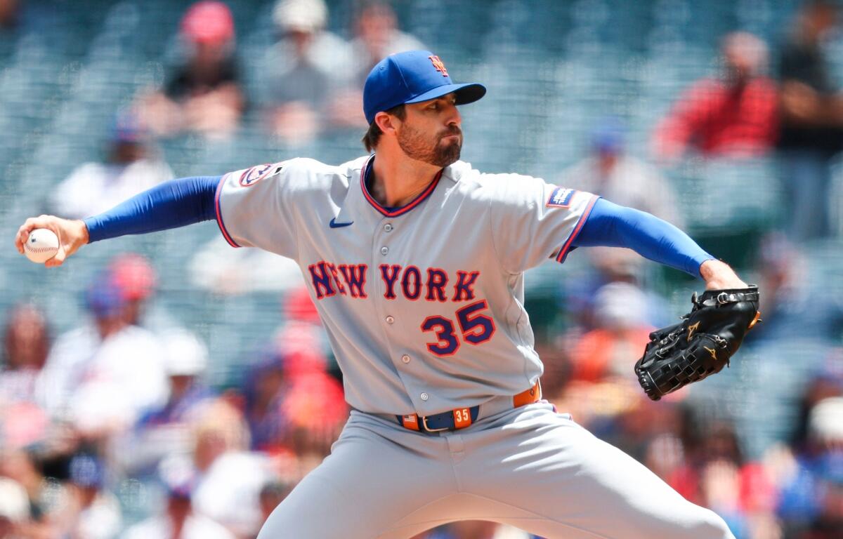 FILE - New York Mets pitcher Clay Holmes throws to a Los Angeles Angels batter during the first inning of a baseball game, May 3, 2026, in Anaheim, Calif. (AP Photo/Jessie Alcheh, File)