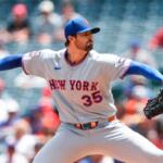 FILE - New York Mets pitcher Clay Holmes throws to a Los Angeles Angels batter during the first inning of a baseball game, May 3, 2026, in Anaheim, Calif. (AP Photo/Jessie Alcheh, File)