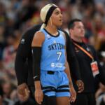Chicago Sky's DiJonai Carrington walks off the court ejected from the game for committing a flagrant foul against Indiana Fever's Sophie Cunningham during the first half of an WNBA basketball game in Chicago, Saturday, Aug. 8, 2026. (AP Photo/Paul Beaty)