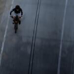 A boy rides an e-bike in Santa Monica, Calif., Monday, Aug. 10, 2026. (AP Photo/Jae C. Hong)