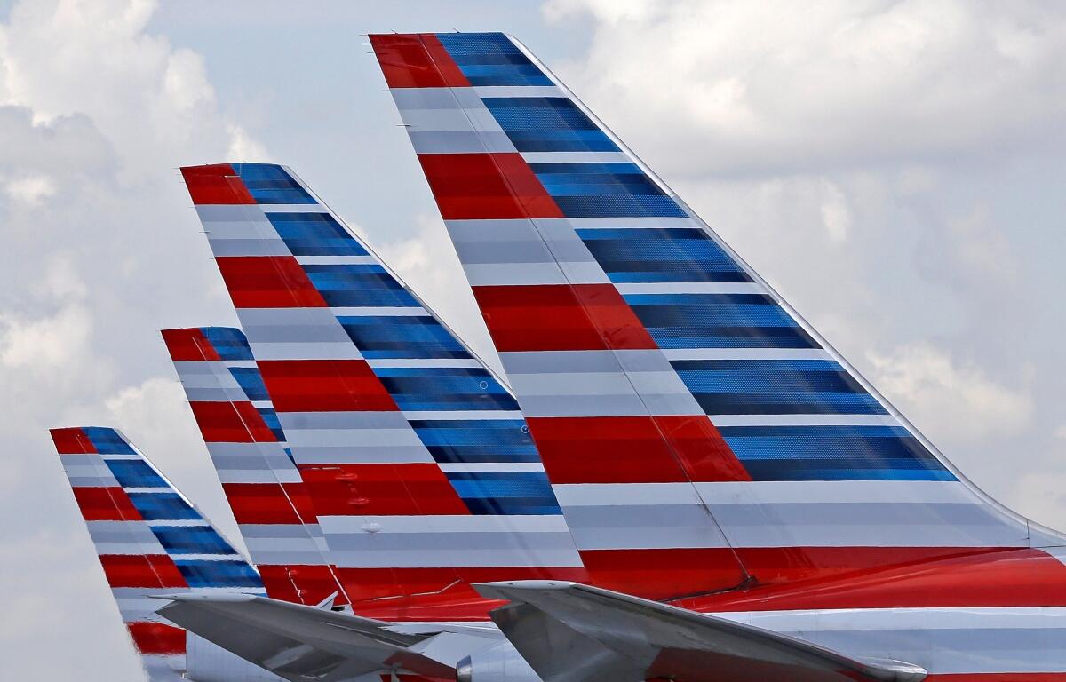 FILE - American Airlines passenger planes are parked at Miami International Airport, in Miami on July 17, 2015. (AP Photo/Alan Diaz, File)