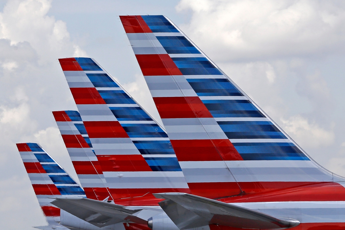 FILE - American Airlines passenger planes are parked at Miami International Airport, in Miami on July 17, 2015. (AP Photo/Alan Diaz, File)