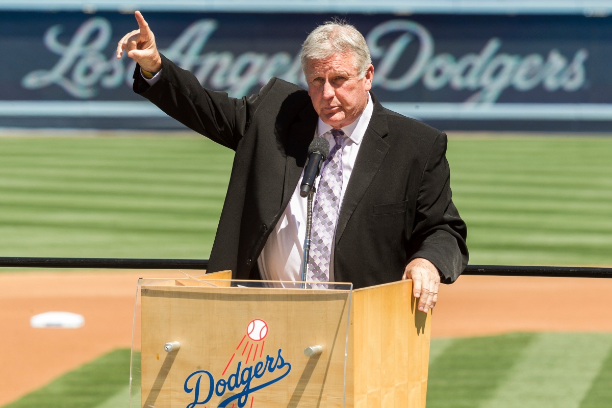 FILE - Los Angeles Dodgers former pitcher Tommy John praises his late friend, Dr. Frank Jobe during a memorial service at Dodger Stadium in Los Angeles, April 7, 2014. (AP Photo/Damian Dovarganes, File)