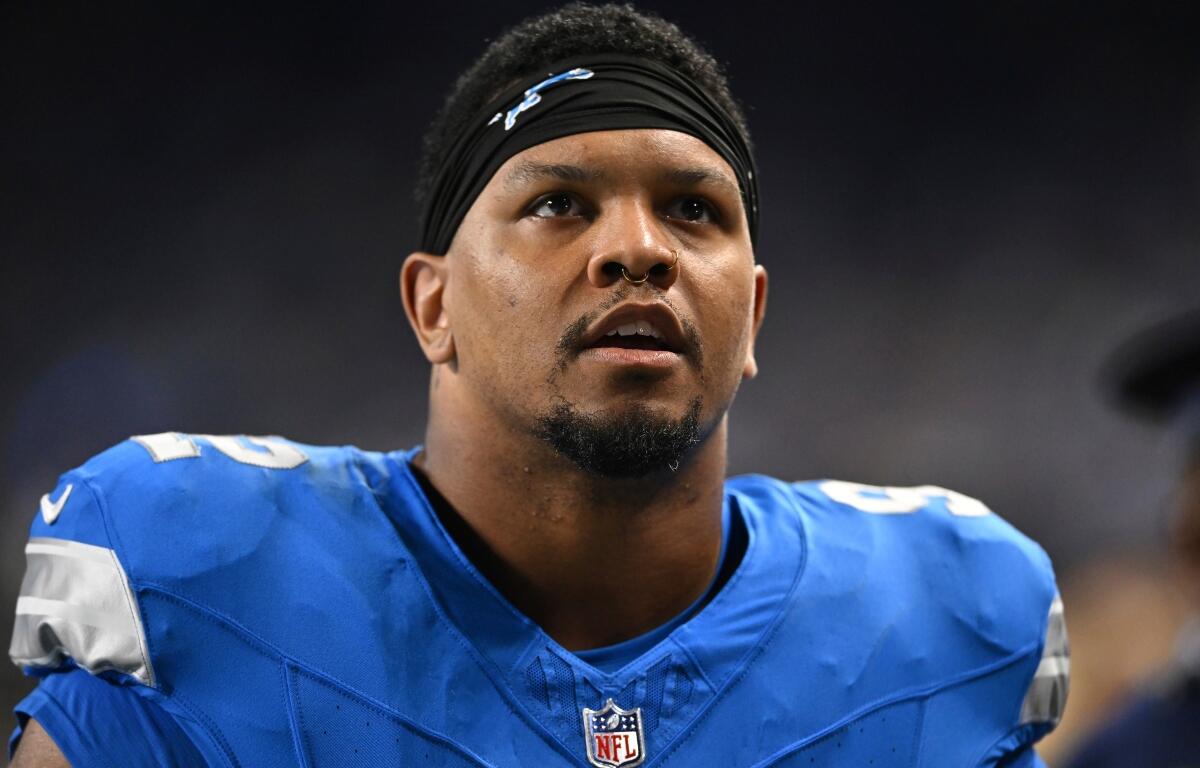 FILE - Detroit Lions defensive end Marcus Davenport walks to the locker room before an NFL football game against the Los Angeles Rams, Sept. 8, 2024, in Detroit. (AP Photo/David Dermer, File)