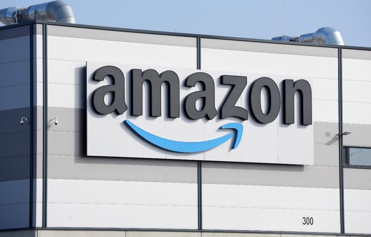 FILE - An Amazon company logo marks the facade of a building, March 18, 2022, in Schoenefeld near Berlin. (AP Photo/Michael Sohn, File)