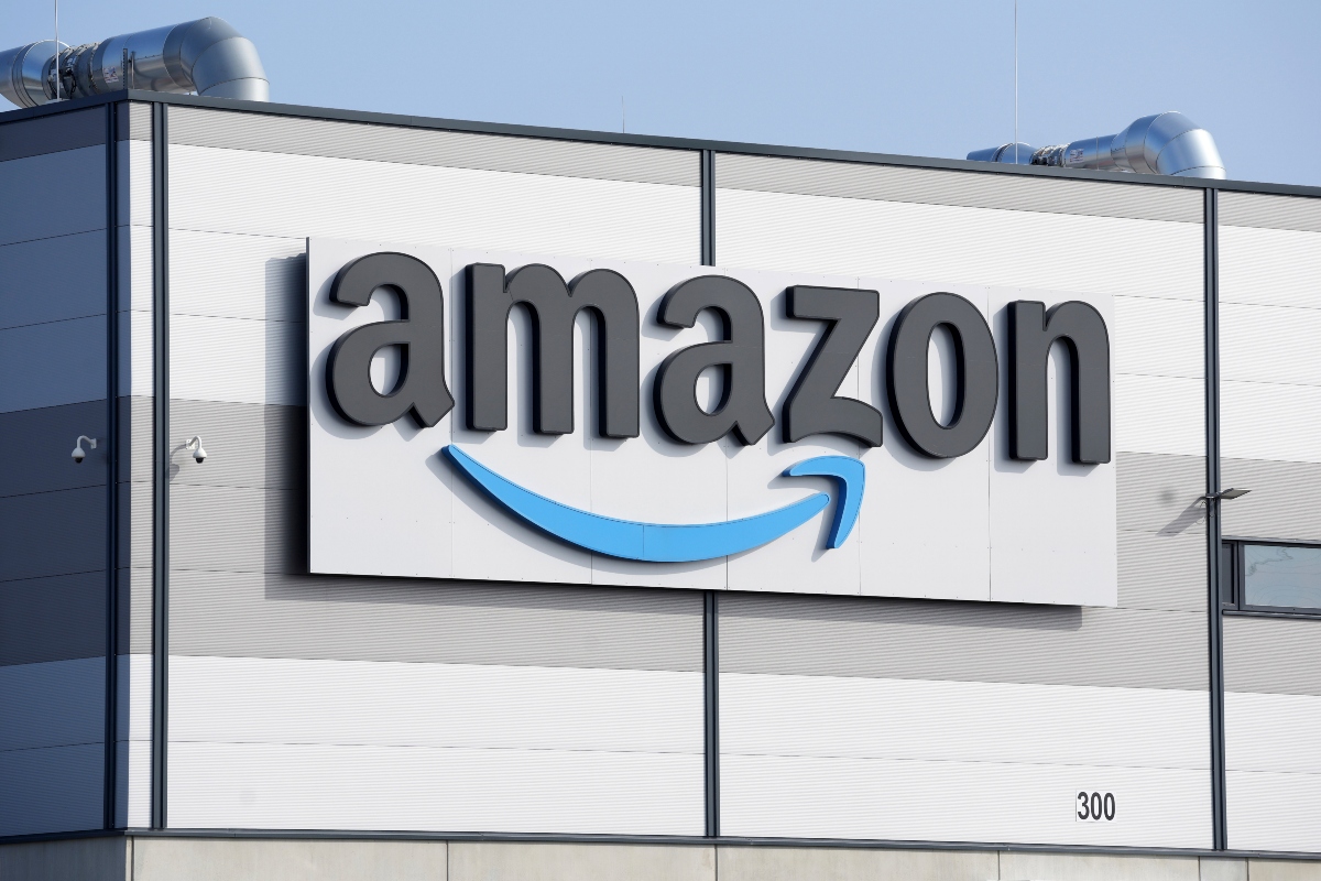 FILE - An Amazon company logo marks the facade of a building, March 18, 2022, in Schoenefeld near Berlin. (AP Photo/Michael Sohn, File)