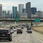 FILE - Motorists drive on southbound Interstate 25 with the city skyline in the background April 30, 2026, in Denver. (AP Photo/David Zalubowski, File)