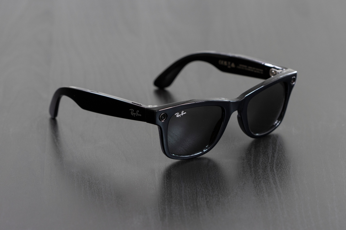 Portland, OR, USA - Dec 5, 2023: A pair of new Ray-Ban Meta Wayfarer smart glasses isolated on a dark gray background.