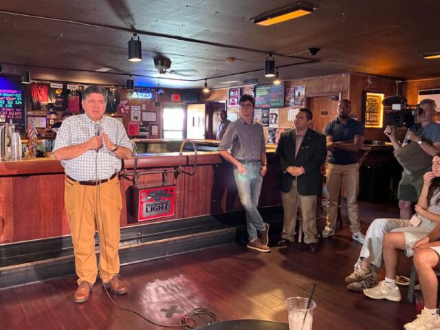 Gov. JB Pritzker speaks to University of Illinois students at Rose Bowl Tavern in Urbana on Thursday, Aug. 27, 2026. (Capitol News Illinois photo by Ben Szalinski)