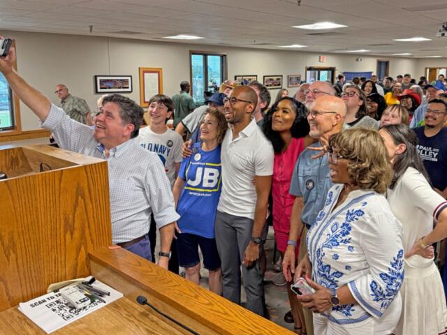 Gov. JB Pritzker takes a selfie with supporters at a union hall in East Peoria on Saturday, Aug. 29, 2026. (Capitol News Illinois photo by Brenden Moore)