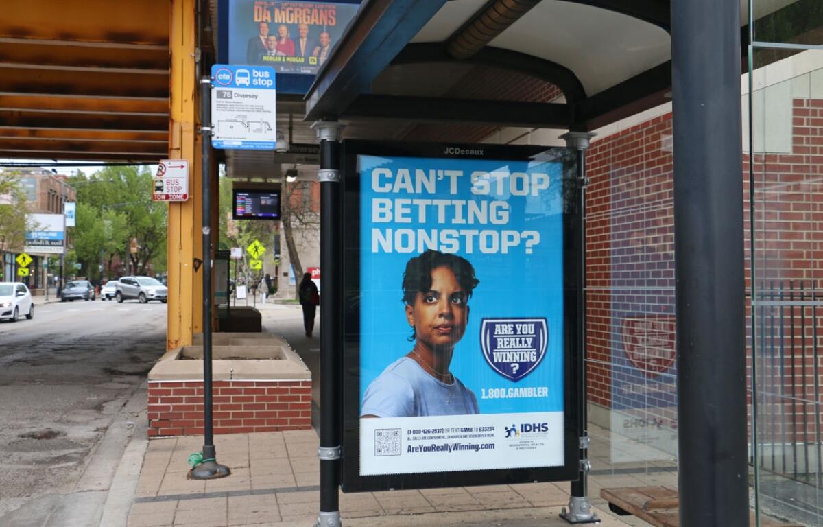 A Chicago bus stop advertises the state’s gambling addiction helpline. (Capitol News Illinois photo by Maggie Dougherty)