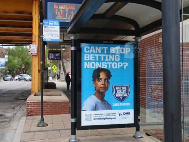 A Chicago bus stop advertises the state’s gambling addiction helpline. (Capitol News Illinois photo by Maggie Dougherty)