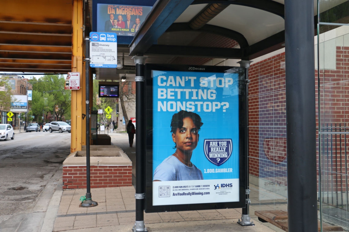 A Chicago bus stop advertises the state’s gambling addiction helpline. (Capitol News Illinois photo by Maggie Dougherty)