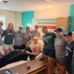 Players in the Women's Professional Baseball League visit with one of the patients of HSHS St. John's Children's Hospital Thursday, September 3.