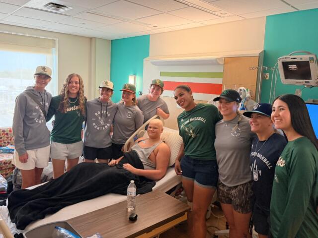 Players in the Women's Professional Baseball League visit with one of the patients of HSHS St. John's Children's Hospital Thursday, September 3.
