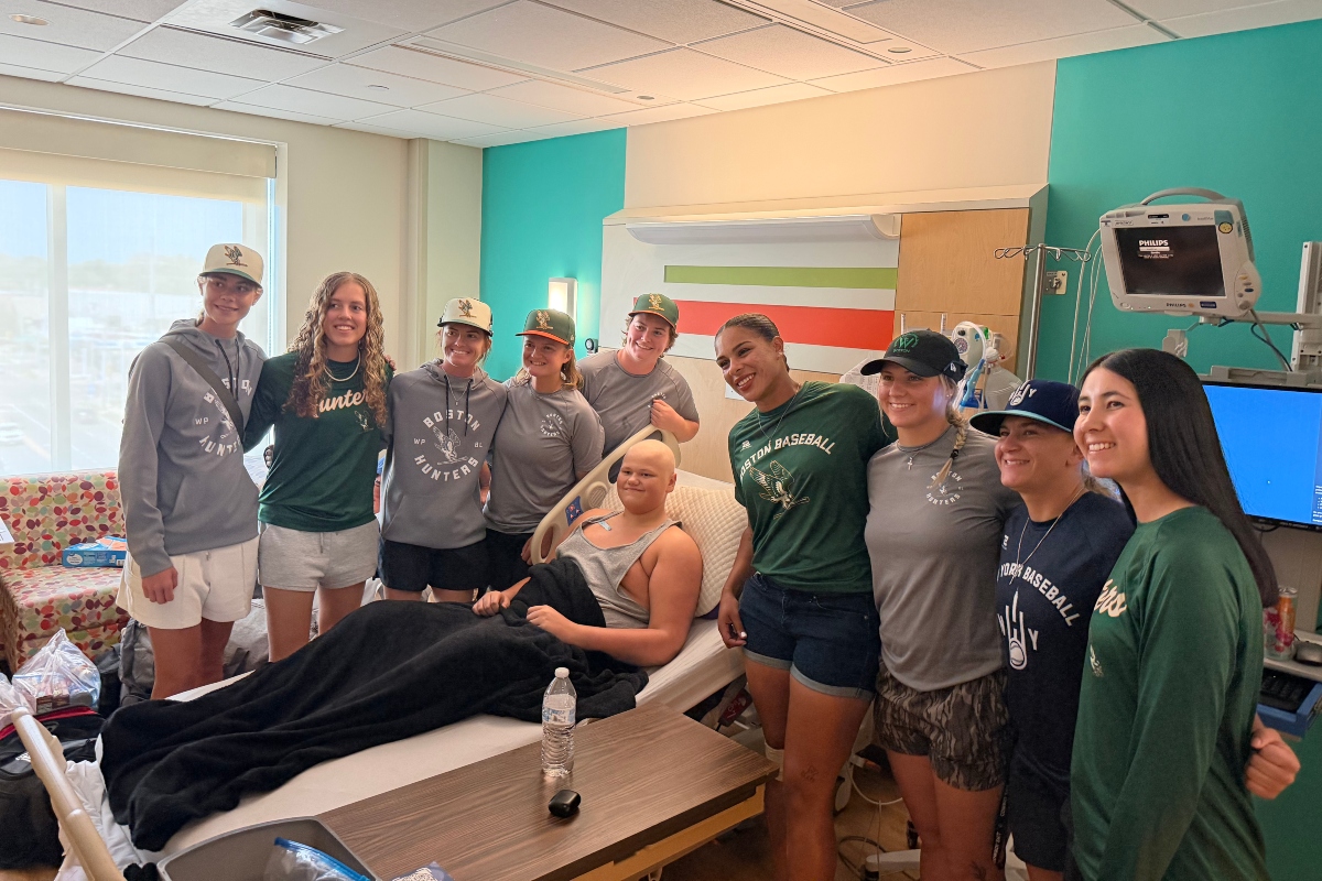 Players in the Women's Professional Baseball League visit with one of the patients of HSHS St. John's Children's Hospital Thursday, September 3.