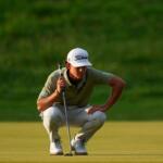 Jackson Koivun lines up his ball on the first green during the first round of the St. Jude Championship golf tournament, Thursday, Aug. 13, 2026, in Memphis, Tenn. (AP Photo/George Walker IV)