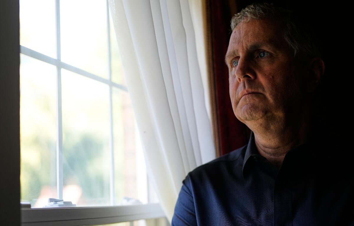 Michael Rabbitt poses for a photo at his home in Chicago, Thursday, Aug. 27, 2026. (AP Photo/Nam Y. Huh)