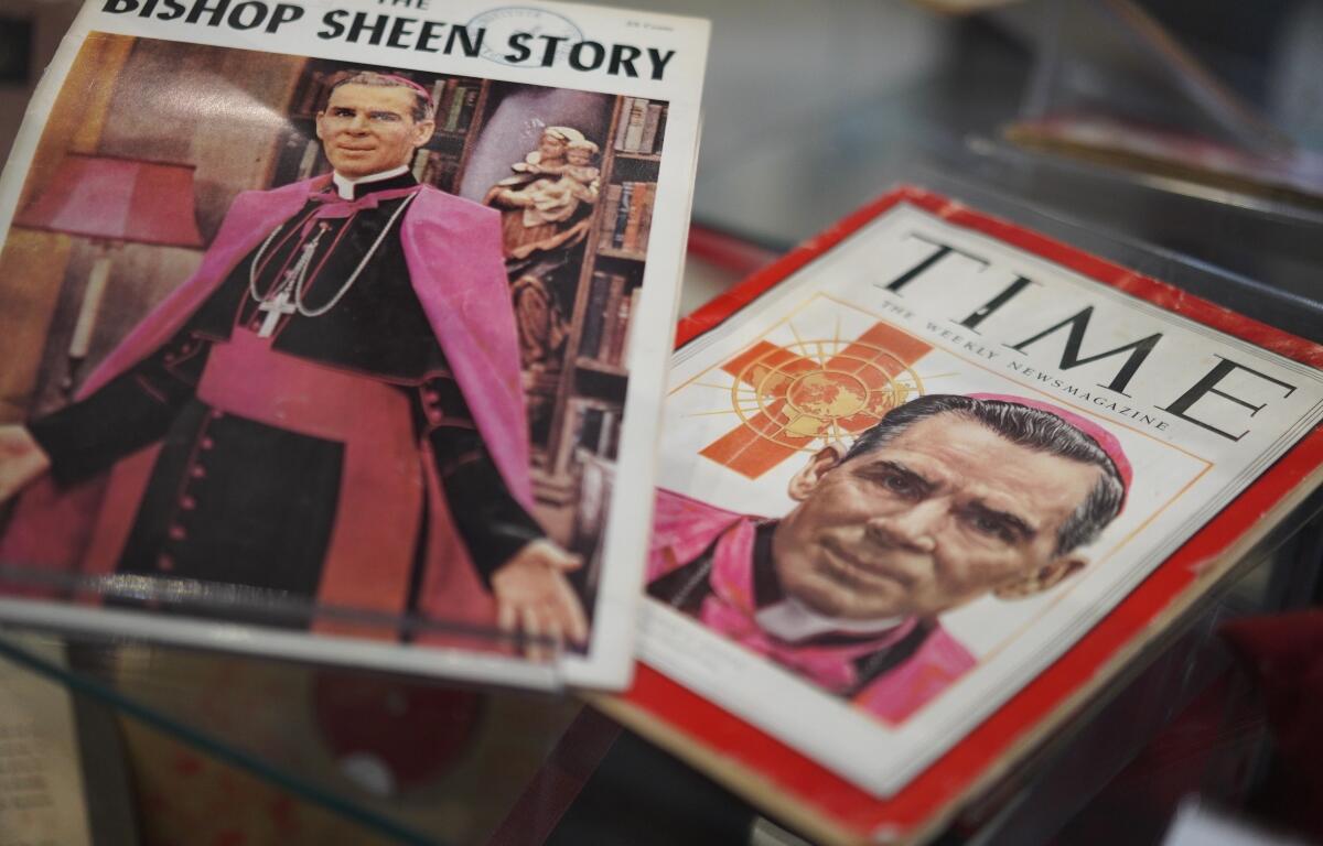Artifacts and memorabilia depicting the late Archbishop Fulton Sheen are displayed in the Sheen Museum on July 15, 2026, in Peoria, Ill. (AP Photo/Jessie Wardarski)