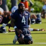 FILE - Chicago Bears running back D'Andre Swift warms up during practice at the team's NFL football training camp, Thursday, July 30, 2026, in Lake Forest, Ill. (AP Photo/Nam Y. Huh,File)