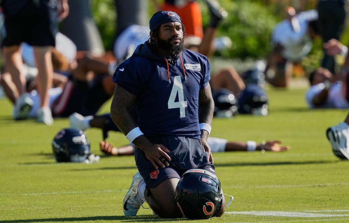 FILE - Chicago Bears running back D'Andre Swift warms up during practice at the team's NFL football training camp, Thursday, July 30, 2026, in Lake Forest, Ill. (AP Photo/Nam Y. Huh,File)