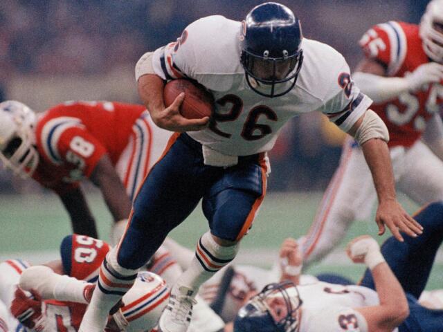 FILE - Chicago Bear's Matt Suhey (26) heads for a touchdown during the NFL Super Bowl 20 football game against the New England Patriots in New Orleans, Jan. 26, 1986. (AP Photo, File)