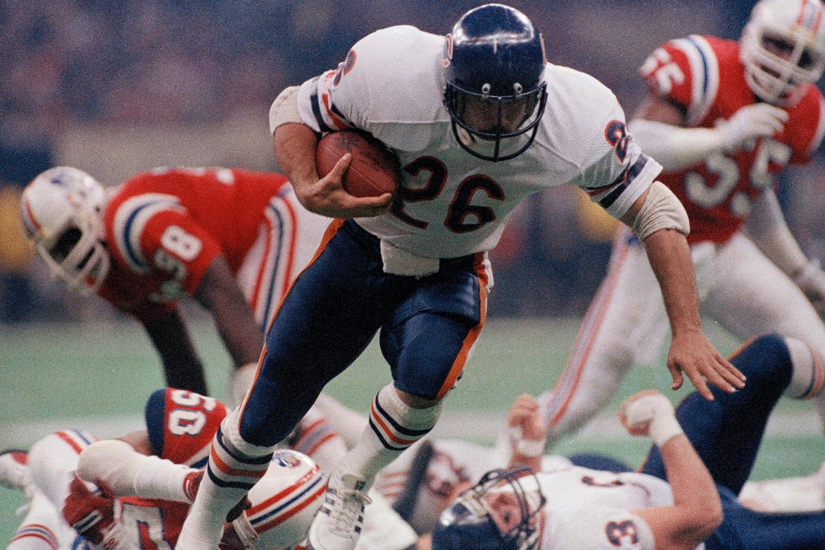 FILE - Chicago Bear's Matt Suhey (26) heads for a touchdown during the NFL Super Bowl 20 football game against the New England Patriots in New Orleans, Jan. 26, 1986. (AP Photo, File)