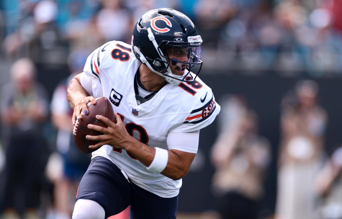 Chicago Bears quarterback Caleb Williams (18) looks to pass during the first half of an NFL football game, Sunday, Sept. 13, 2026, in Charlotte, N.C. (AP Photo/Scott Kinser)