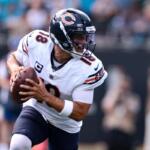 Chicago Bears quarterback Caleb Williams (18) looks to pass during the first half of an NFL football game, Sunday, Sept. 13, 2026, in Charlotte, N.C. (AP Photo/Scott Kinser)